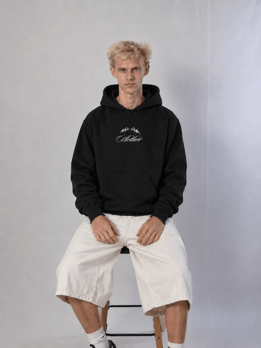 - Blacked Out Hoodie – model wearing hoodie