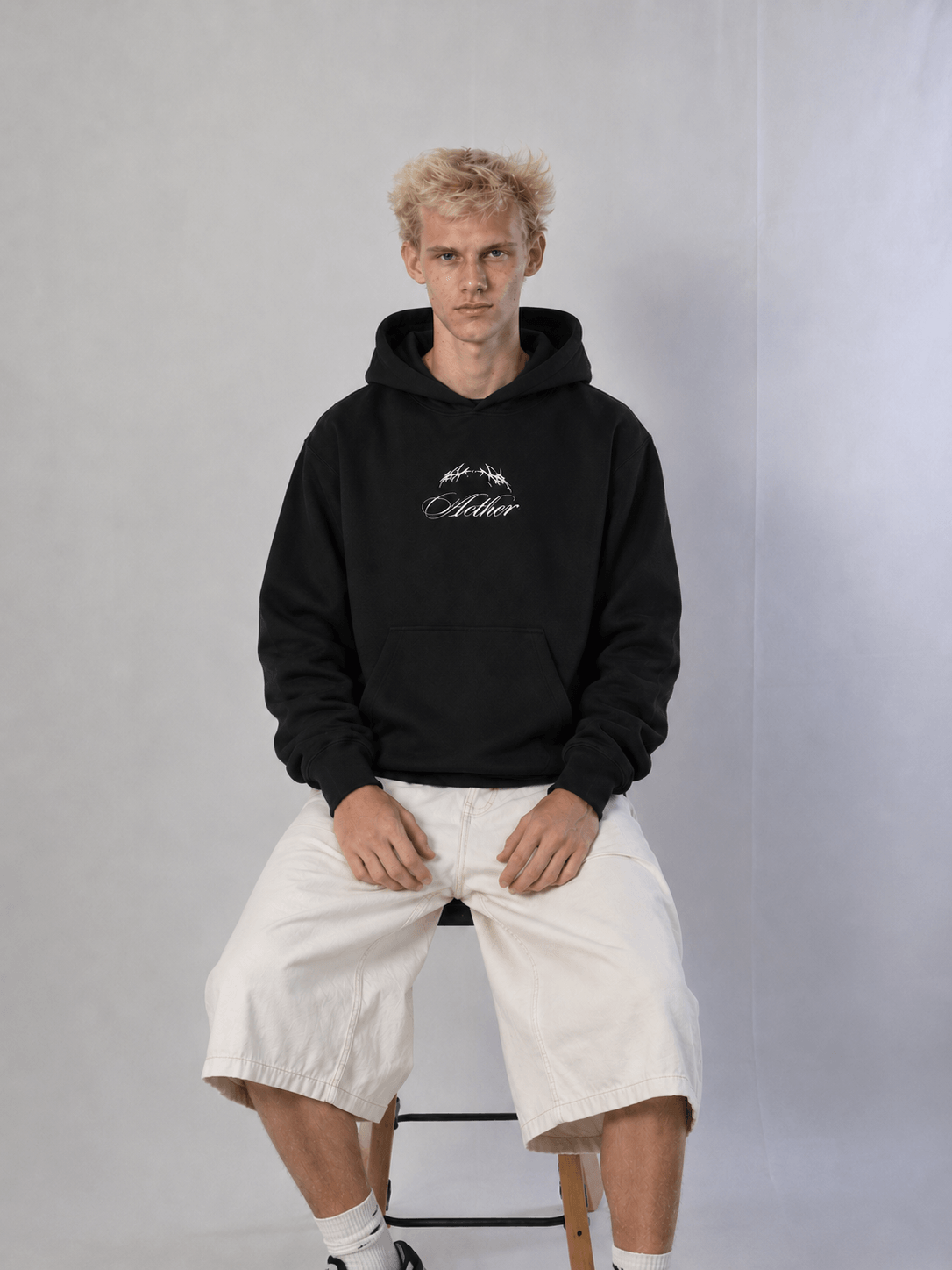 - Blacked Out Hoodie – model wearing hoodie
